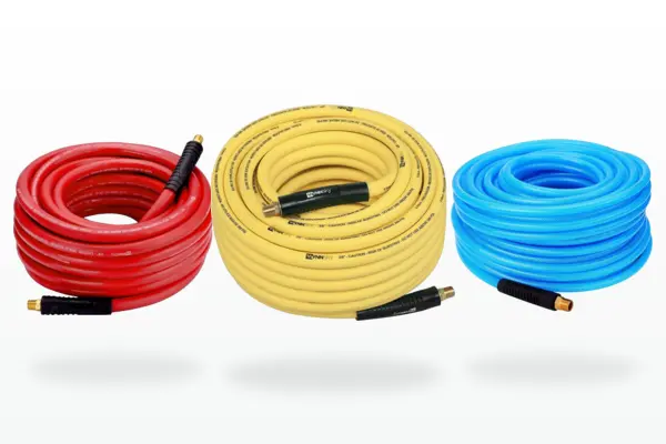 Red, yellow and blue air compressor hoses for workshop use